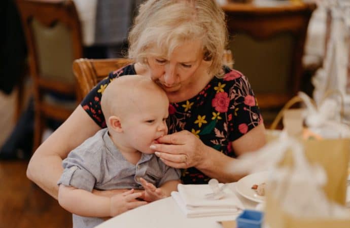 Grandmother feeding baby at Berwick Lodge